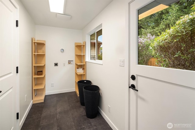 doorway featuring baseboards