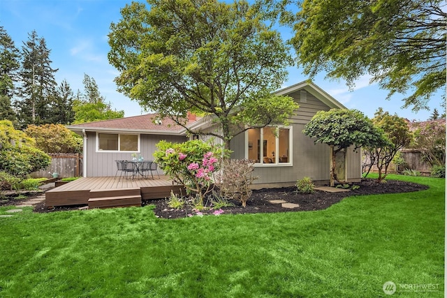 rear view of house with a wooden deck
