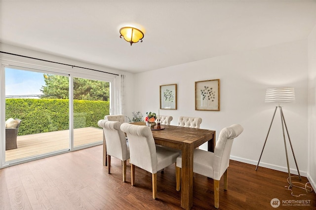 dining area with wood finished floors and baseboards