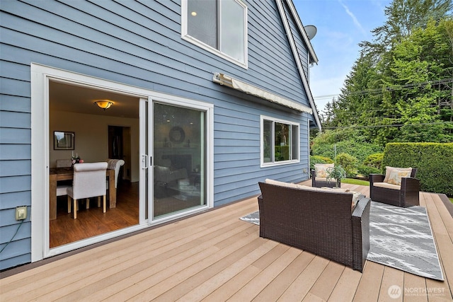 wooden deck with outdoor lounge area
