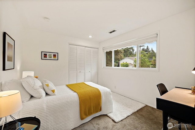 carpeted bedroom featuring a closet