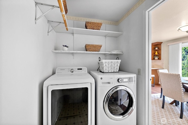 washroom featuring washing machine and dryer
