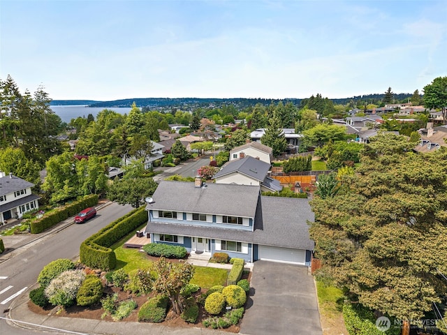 aerial perspective of suburban area featuring a large body of water
