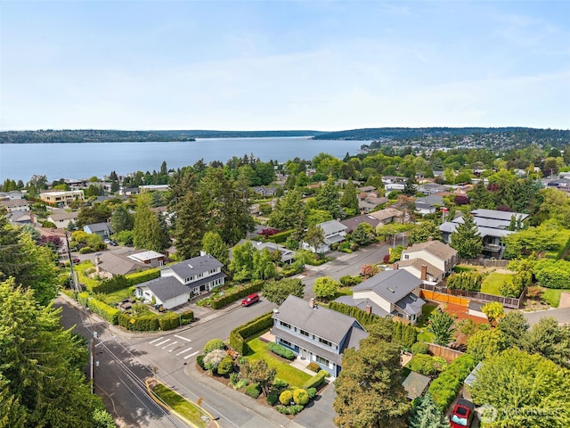 aerial perspective of suburban area featuring a nearby body of water