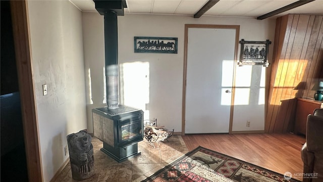 169 Twin Lakes Dr, Winthrop, WA 98862 - entrance foyer with a wood stove, wood finished floors, and baseboards