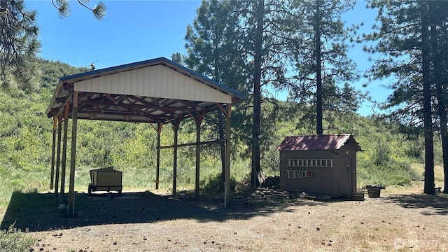 169 Twin Lakes Dr, Winthrop, WA 98862 - view of home's community featuring a detached carport, a gazebo, and a wooded view