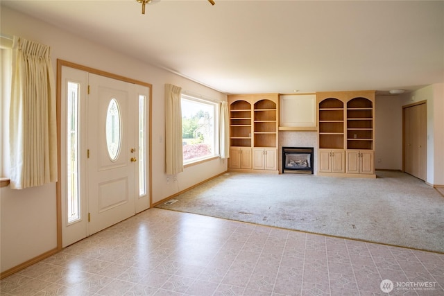28705 48th Ave NW, Stanwood, WA 98292 - foyer featuring light carpet and a glass covered fireplace