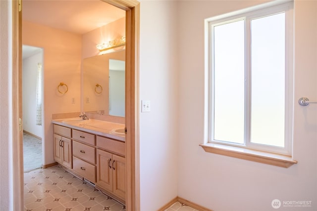 28705 48th Ave NW, Stanwood, WA 98292 - bathroom featuring double vanity and baseboards
