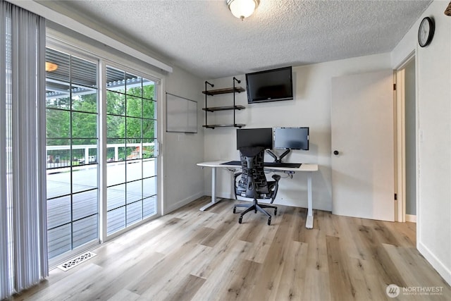 17634 118th Ave SE, Renton, WA 98058 - office area featuring a textured ceiling, wood finished floors, and baseboards