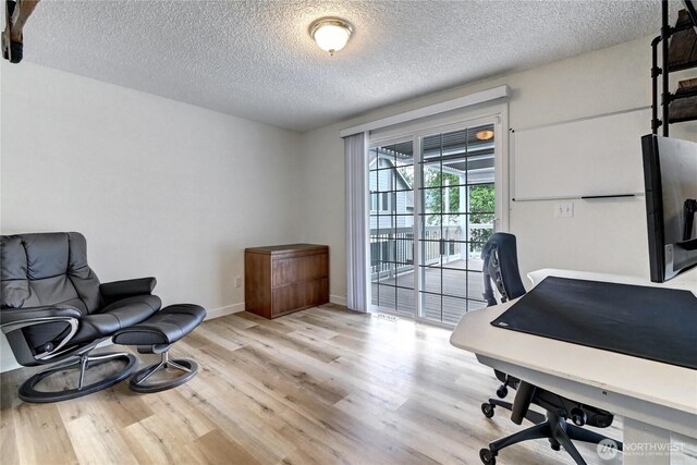 17634 118th Ave SE, Renton, WA 98058 - office space with a textured ceiling, light wood finished floors, and baseboards