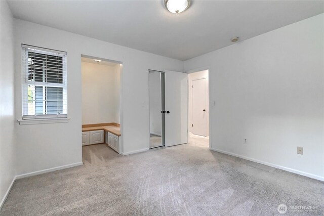 17634 118th Ave SE, Renton, WA 98058 - unfurnished bedroom featuring light colored carpet and baseboards