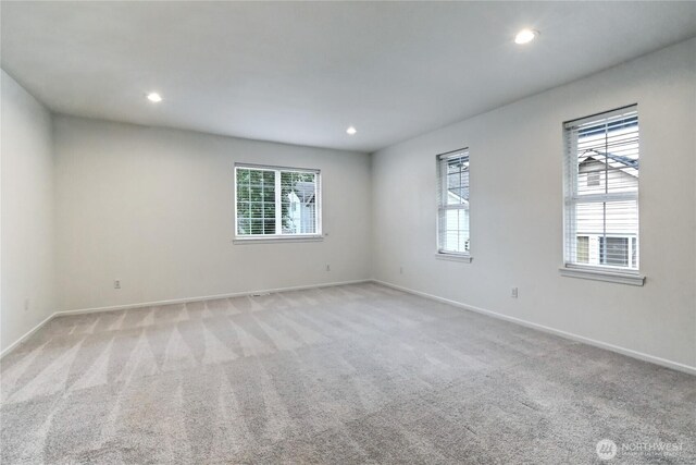 17634 118th Ave SE, Renton, WA 98058 - spare room with plenty of natural light, baseboards, recessed lighting, and light colored carpet