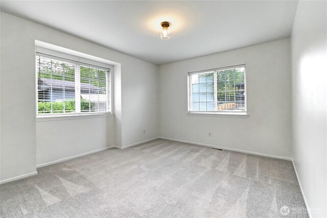 17634 118th Ave SE, Renton, WA 98058 - carpeted spare room featuring baseboards