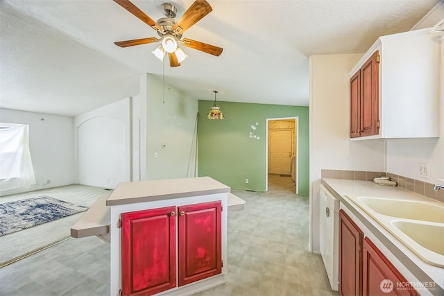 201 W Oakview Ave Unit 48, Centralia, WA 98531 - kitchen with light flooring, a ceiling fan, light countertops, a center island, and a textured ceiling