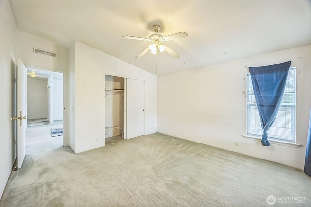 201 W Oakview Ave Unit 48, Centralia, WA 98531 - unfurnished bedroom with lofted ceiling, light carpet, a closet, and ceiling fan