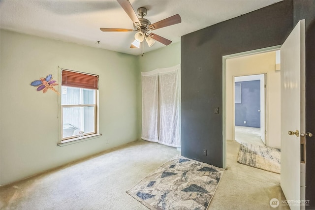 201 W Oakview Ave Unit 48, Centralia, WA 98531 - unfurnished bedroom featuring carpet flooring and a ceiling fan