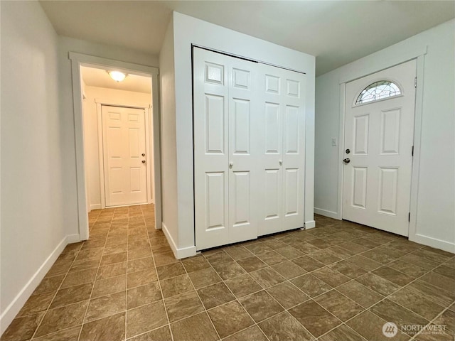 8312 121st St SW, Lakewood, WA 98498 - entryway featuring baseboards and stone finish floors