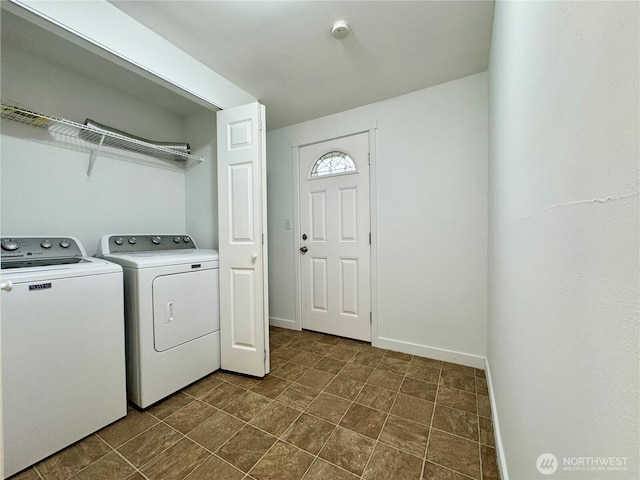 8312 121st St SW, Lakewood, WA 98498 - washroom featuring separate washer and dryer and baseboards