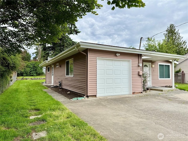 8312 121st St SW, Lakewood, WA 98498 - view of front of home featuring an attached garage, asphalt driveway, and a front lawn