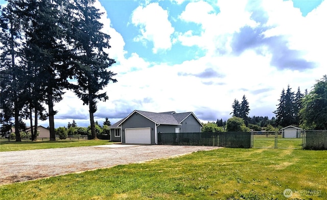 9441 180th Way SW, Rochester, WA 98579 - view of yard featuring driveway and an attached garage