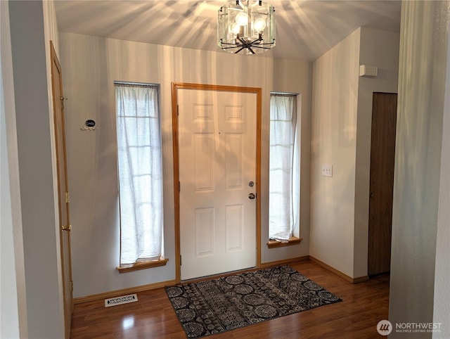 9441 180th Way SW, Rochester, WA 98579 - entrance foyer featuring baseboards, a chandelier, and wood finished floors