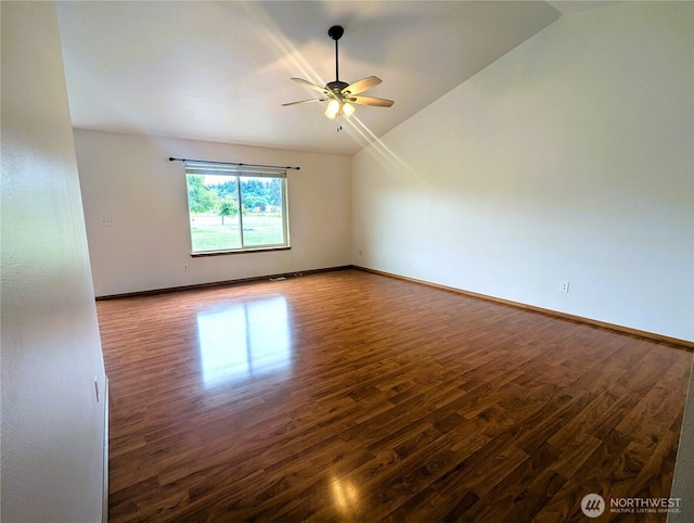 9441 180th Way SW, Rochester, WA 98579 - unfurnished room featuring vaulted ceiling, wood finished floors, a ceiling fan, and baseboards