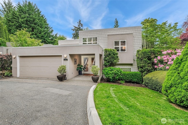 11120 NE 106th Pl, Kirkland, WA 98033 - view of front of property with french doors, a garage, driveway, stucco siding, and a front lawn