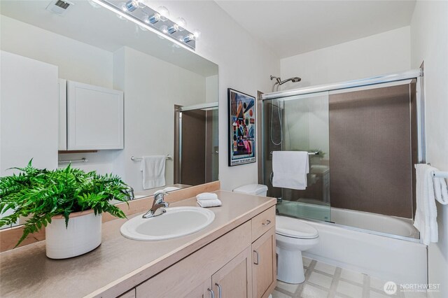 11120 NE 106th Pl, Kirkland, WA 98033 - bathroom with tile patterned floors, bath / shower combo with glass door, vanity, and toilet