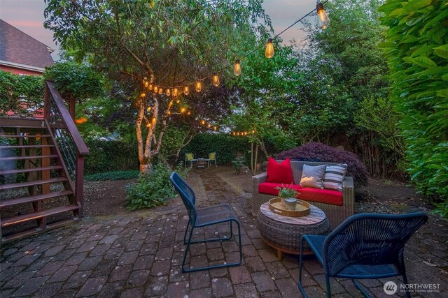 view of patio with stairs and an outdoor hangout area