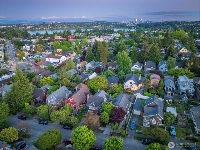 aerial perspective of suburban area featuring a large body of water