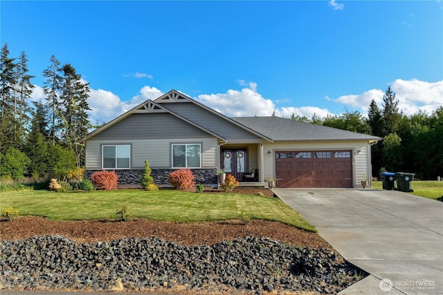 1109 Walker St, Port Angeles, WA 98363 - craftsman-style home with a garage, driveway, a front yard, and stone siding