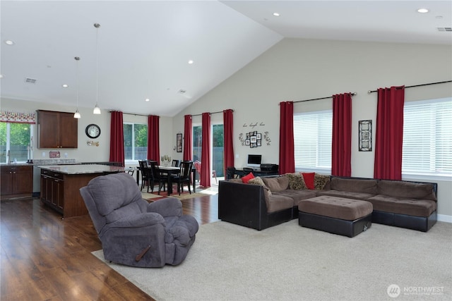 1109 Walker St, Port Angeles, WA 98363 - living room with plenty of natural light, high vaulted ceiling, recessed lighting, and dark wood finished floors