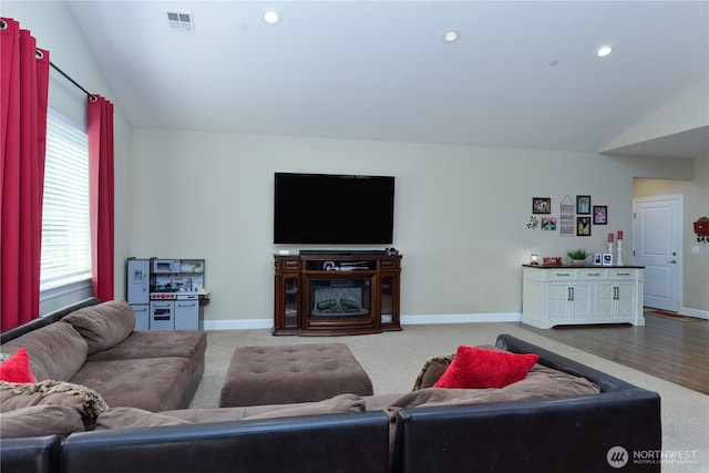 1109 Walker St, Port Angeles, WA 98363 - carpeted living room with vaulted ceiling, healthy amount of natural light, baseboards, and recessed lighting