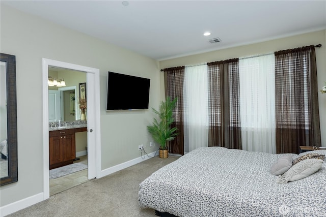 1109 Walker St, Port Angeles, WA 98363 - bedroom featuring light colored carpet, baseboards, and ensuite bathroom