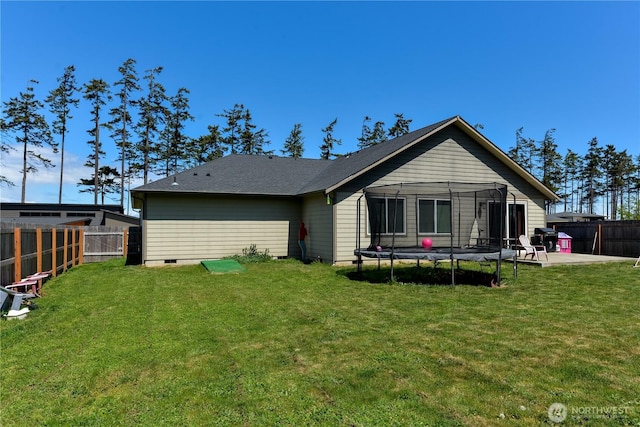 1109 Walker St, Port Angeles, WA 98363 - back of house featuring a trampoline and a patio area