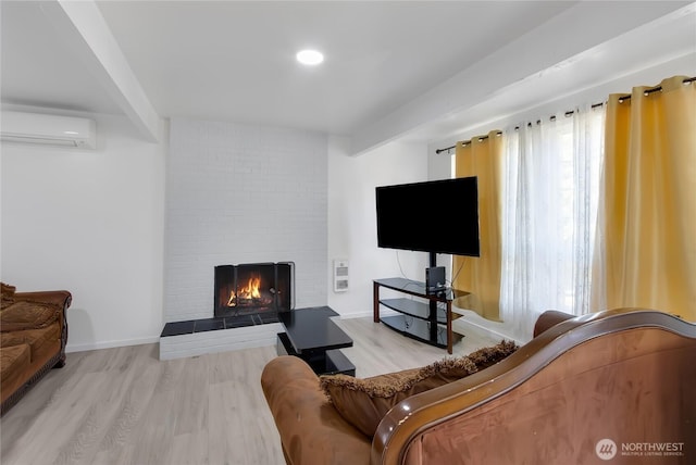 7412 E E St, Tacoma, WA 98404 - living area featuring a wall unit AC, wood finished floors, a brick fireplace, and recessed lighting