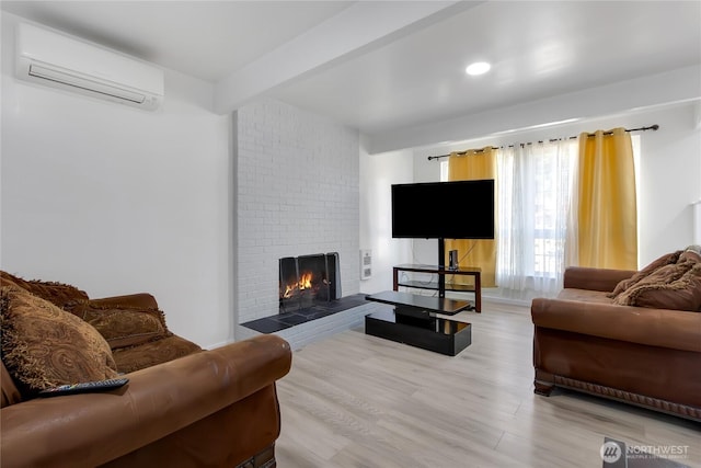 7412 E E St, Tacoma, WA 98404 - living area featuring a wall unit AC, light wood-type flooring, and a brick fireplace