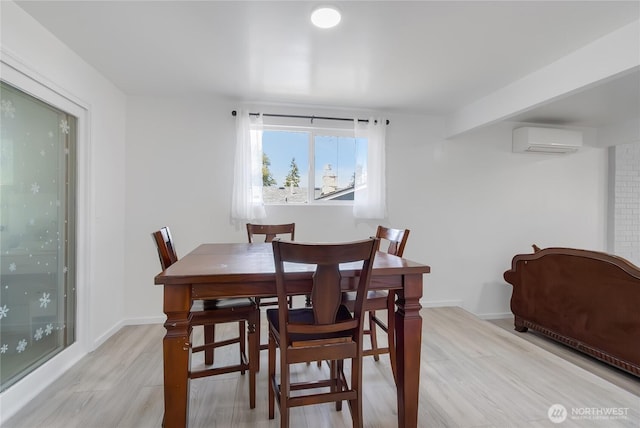 7412 E E St, Tacoma, WA 98404 - dining area with a wall mounted air conditioner and light wood-style flooring