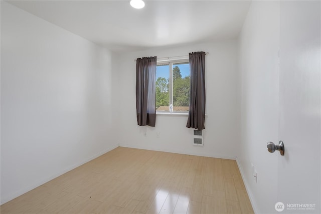7412 E E St, Tacoma, WA 98404 - unfurnished room featuring wood finished floors and baseboards
