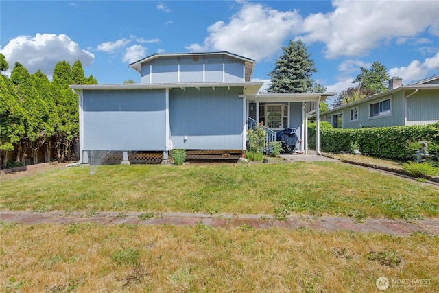 7412 E E St, Tacoma, WA 98404 - rear view of property with a yard