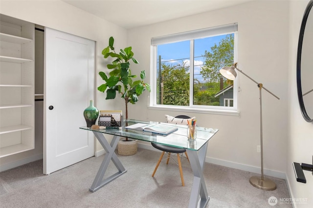 carpeted office with baseboards