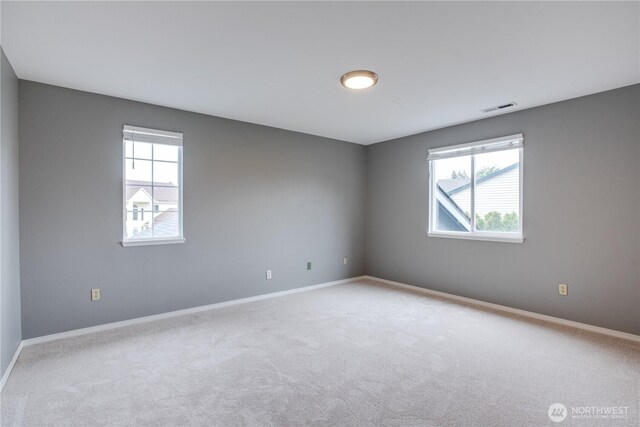 16016 NE 41st St, Vancouver, WA 98628 - empty room with healthy amount of natural light, carpet flooring, and baseboards