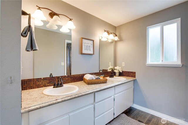 16016 NE 41st St, Vancouver, WA 98628 - full bath featuring backsplash, wood finished floors, double vanity, and baseboards