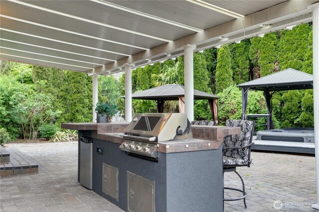 16016 NE 41st St, Vancouver, WA 98628 - view of patio / terrace featuring a gazebo, area for grilling, exterior kitchen, and a wooded view