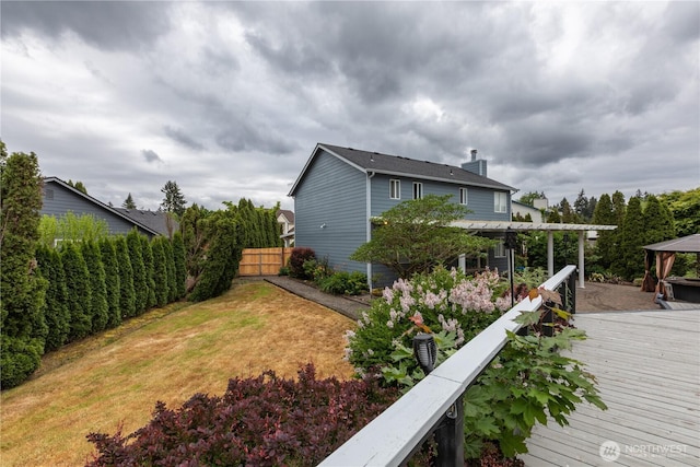16016 NE 41st St, Vancouver, WA 98628 - rear view of property featuring a chimney, fence, a gazebo, and a wooden deck