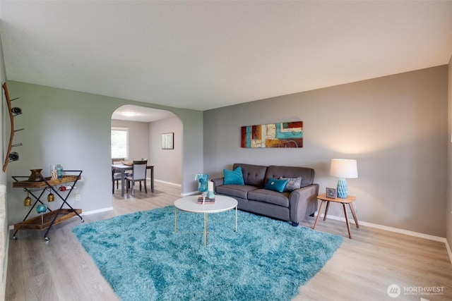 16016 NE 41st St, Vancouver, WA 98628 - living room with arched walkways, light wood finished floors, and baseboards