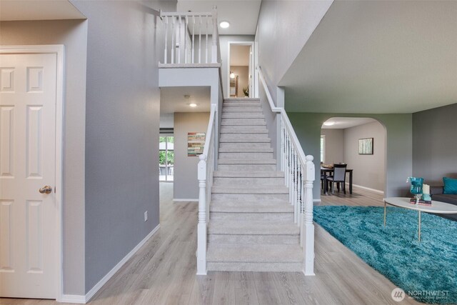 16016 NE 41st St, Vancouver, WA 98628 - stairs with arched walkways, wood finished floors, and baseboards