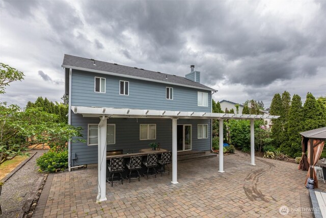 16016 NE 41st St, Vancouver, WA 98628 - rear view of house featuring a patio and a chimney