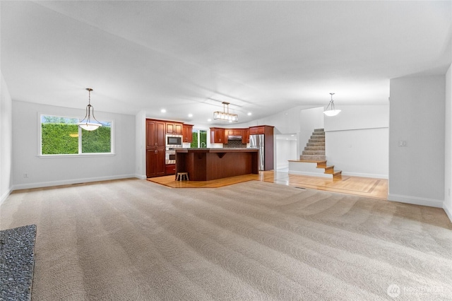 16912 49th St E, Lake Tapps, WA 98391 - unfurnished living room with light colored carpet, baseboards, stairway, recessed lighting, and lofted ceiling