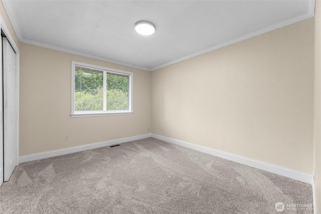 16912 49th St E, Lake Tapps, WA 98391 - unfurnished bedroom featuring baseboards, ornamental molding, carpet flooring, and a closet
